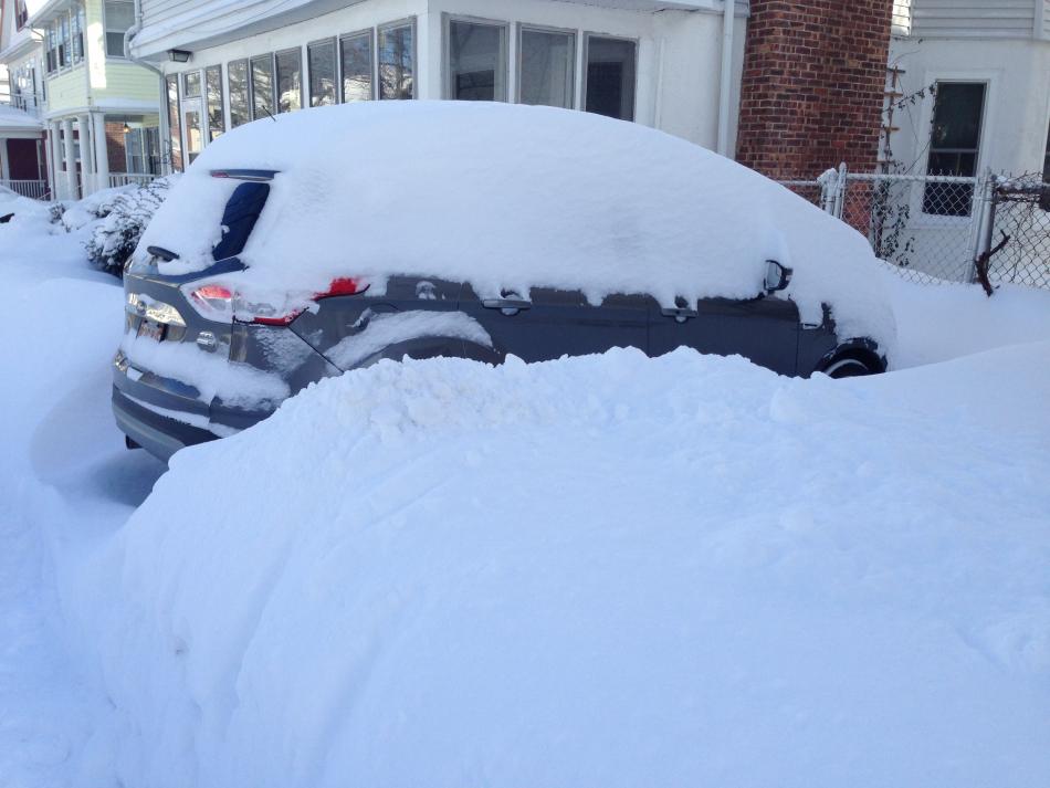 Photo of car buried by snow 